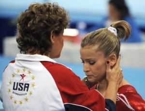 Alicia Sacramone is consoled by U.S. National Team Coordinator Martha Karolyi after a disappointing performance during the women's team final in Beijing Tuesday night.